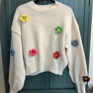 Cozy White Sweater with Colorful Floral Accents